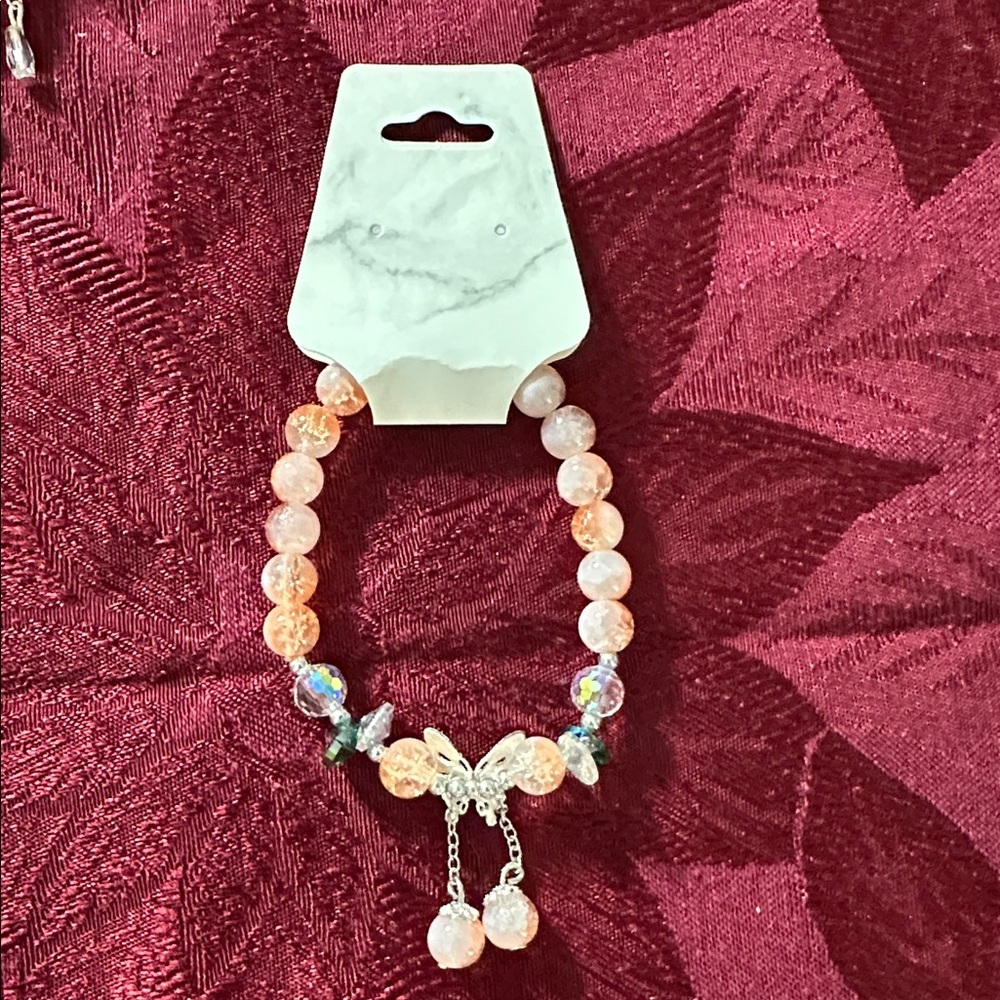 Sweet Clear/Tangerine Glass Bead Bracelet Featuring a Whimsical Butterfly Charm - Picture 3 of 4
